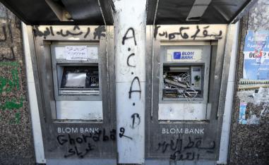 A vandalised ATM machine is pictured at the al-Nour Square in the northern port city of Tripoli