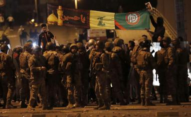 Army soldiers and riot police formed a barrier separating the protesters from the supporters of the Shi'ite groups