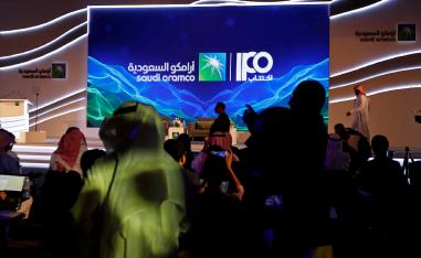 A sign of Saudi Aramco's initial public offering is seen before the start of a news conference by the state oil company at the Plaza Conference Center in Dhahran