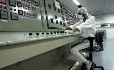 A technician works at the Uranium Conversion Facility just outside the city of Isfahan