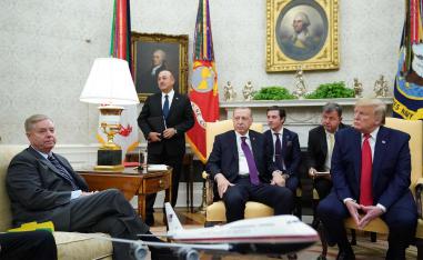 Sen. Lindsey Graham (L) listens as US President Donald Trump and Turkey's President Recep Tayyip Erdogan(C) 