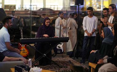 Saudi female musician Lojain Sami plays a keyboard at a local cafe in Khobar.
