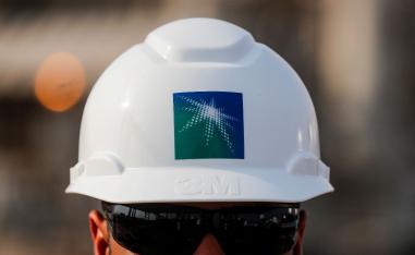 An employee in a branded helmet is pictured at Saudi Aramco oil facility in Abqaiq