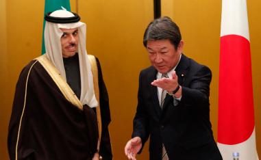 Japanese Foreign Minister Toshimitsu Motegi shows the way to Saudi Arabia's counterpart Prince Faisal bin Farhan at a bilateral meeting during the G20 Foreign Ministers meeting in Nagoya