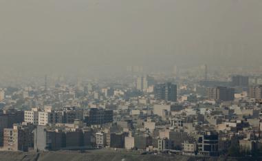 A blanket of brown-white smog covers Tehran due to heavy pollution
