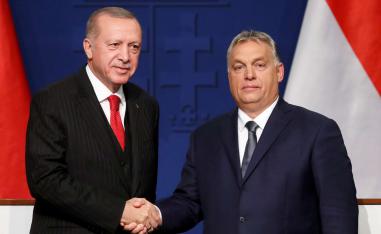 Turkish President Recep Tayyip Erdogan and Hungarian Prime Minister Viktor Orban shake hands during a news conference in Budapest