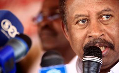 Sudan's prime minister Abdalla Hamdok speaks during a visit to a camp for internally displaced people (IDP) in El-Fasher, the capital of the North Darfur state