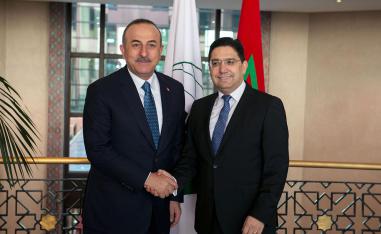 Turkish foreign minister Mevlut Cavusoglu shaking hands with Moroccan counterpart Nasser Bourita
