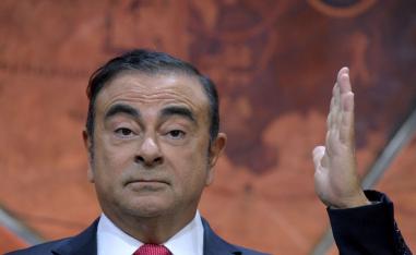 Carlos Ghosn gestures as he addresses a press conference in Paris on September 15, 2017