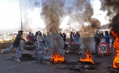 Lebanese protesters block a road in the northern city of Tripoli