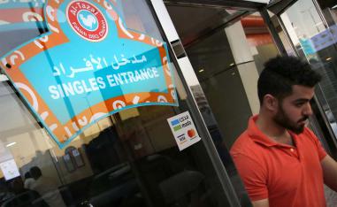 A man leaves the singles entrance at a restaurant in Jeddah
