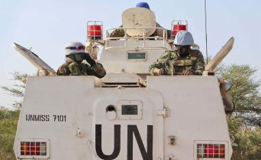 UN peacekeepers in an armored personnel carrier lead a patrol from Bentiu towards the village of Nhialdiu