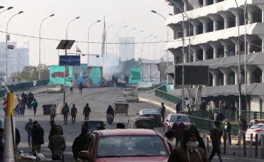Iraqi anti-government protesters gather at al-Sinek bridge in the capital Baghdad