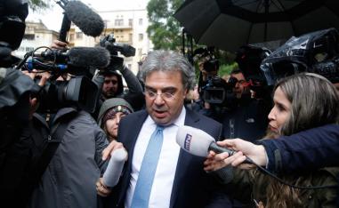 Carlos Abou Jaoude, center, a lawyer for ex-Nissan chief Carlos Ghosn, speaks to journalist as he leaves the judicial palace in Beirut