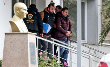 Turkish police officers escort suspects accused of involvement in Nissan's former CEO Carlos Ghosn passage through Istanbul