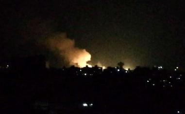 Smoke billowing over buildings