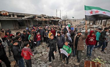 Syrians take part in a demonstration against the regime offensive in Syria's last major opposition bastion of Idlib