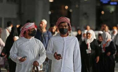 Muslim pilgrims wear masks at the Grand Mosque in Saudi Arabia's holy city of Mecca