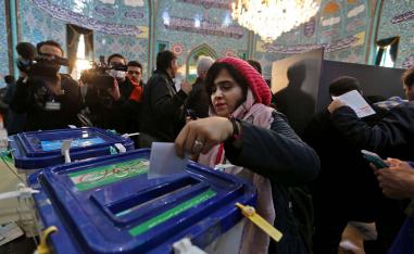 iranian woman casts her ballot