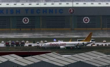 Live images broadcast on Turkish television showed several people climbing through a large crack in the plane