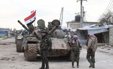 Syrian government forces deploy near the Damascus-Aleppo highway in the southern part of Syria's northern Aleppo province 