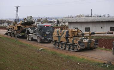 Turkish military convoy is seen near the town of Idlib