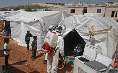 As part of the effort to prevent the worst in the rebel-held Idlib region, a doctor is visiting Yassin's camp in Kafr Lusin to raise awareness