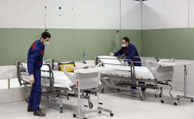 Iranian workers set up a makeshift hospital inside the Iran Mall, northwest of Tehran