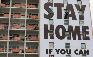 A billboard is installed on an apartment building in Cape Town, South Africa