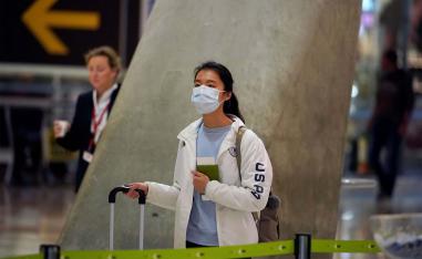  passenger, wearing a protective mask at Madrid's Adolfo Suarez Barajas Airport