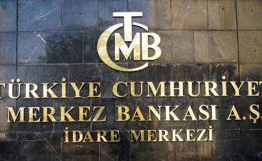 A logo of Turkey's Central Bank (TCMB) is pictured at the entrance of the bank's headquarters in Ankara