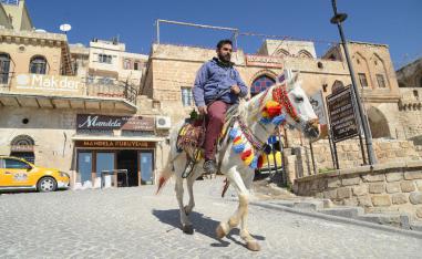 A man rides a horse in the south-eastern Turkish city of Mardin