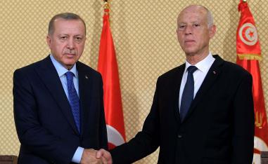Tunisian President Kais Saied (R) shakes hands with Turkish President Recep Tayyip Erdogan during a joint press conference at the presidential palace in Carthage in December 2019