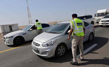 mirati security forces man a checkpoint at the entrance of Abu Dhabi