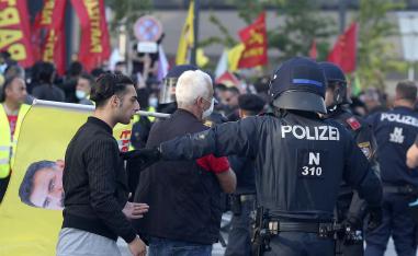 Police separate Kurdish and Turkish demonstrators during a demonstration by Kurdish protesters
