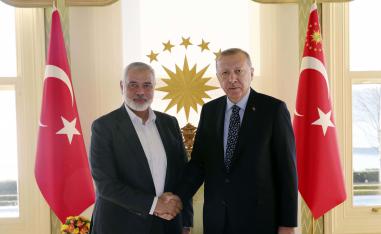 urkey's President Recep Tayyip Erdogan, right, shakes hands with Hamas movement chief Ismail Haniyeh