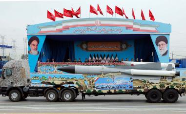 A Iranian military truck carrying a missile drives in front of the officials' stand during a military parade marking the annual National Army Day in Tehran last year