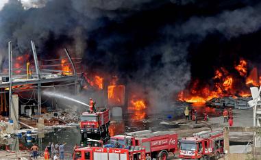 Some Beirut residents have fled the city as fire sends up huge plume of smoke