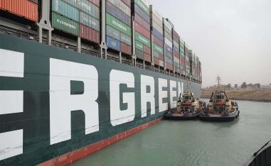 Eight tugs are working to move the giant vessel