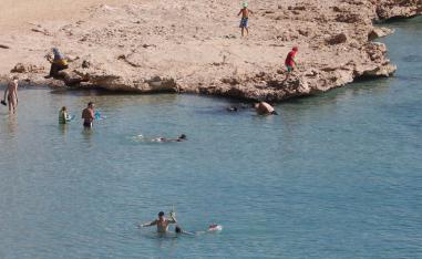 Tourists enjoy a day by the beach in the Red Sea resort of Sharm el-Sheikh.