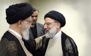ranian Supreme Leader Ayatollah Khamenei talks to Ebrahim Raisi