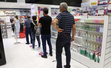 Lebanese queue up in a pharmacy