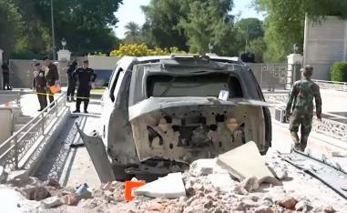 A damaged vehicle in the aftermath of a drone strike on Iraqi prime minister's residence