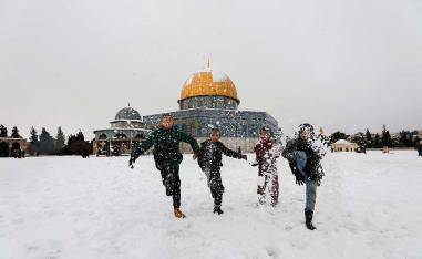 The holy city's iconic golden Dome of the Rock dusted in snow