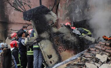 Debris from the crashed fighter jet is seen in Tabriz