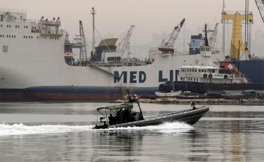 The migrants were apparently taken into custody before their boat was able to set sail