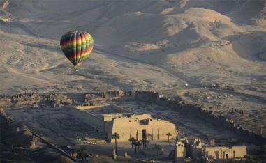 Hot air ballooning over Luxor offers tourists spectacular views of ancient temples in the city