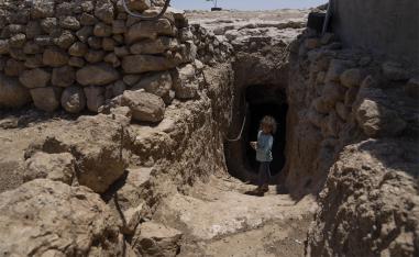 The entrance to Abu Sabaha's cave is surrounded by the ruins of homes and animal pens that the soldiers demolished in earlier raids
