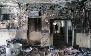 The prison blaze has increased pressure on a government struggling to contain mass protests