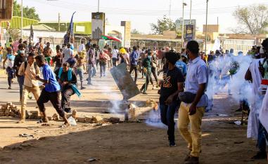 Sudanse security forces fire tear gas on protesters during a protest calling for civilian rule on Nov. 30